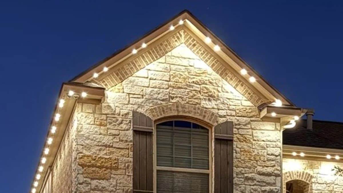 Close-up of a stone gable lit evenly by diffused permanent lights