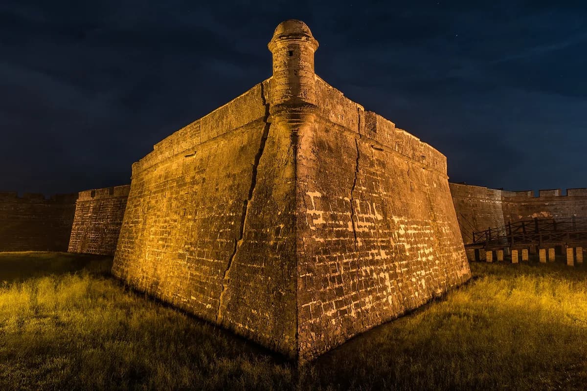The San Pablo Bastion of the Castillo de San Marcos lit at night in St. Augustine